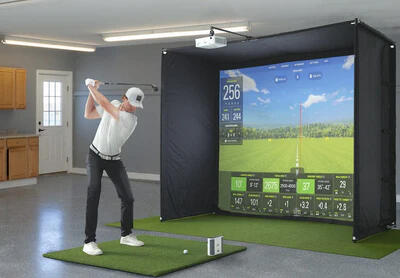 man using a indoor golf simulator